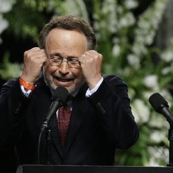 Comedian Billy Crystal imitates Muhammad Ali during his memorial service, Friday, June 10, 2016, in Louisville, Ky. 