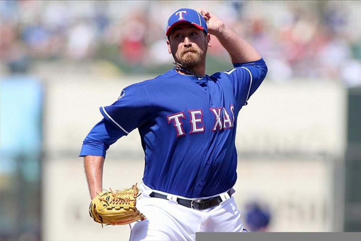 Mar 14, 2012; Surprise, AZ, USA; Texas Rangers relief pitcher Michael Kirkman (44) pitches against the Colorado Rockies during the fourth inning at Surprise Stadium.  Mandatory Credit: Jake Roth-US PRESSWIRE