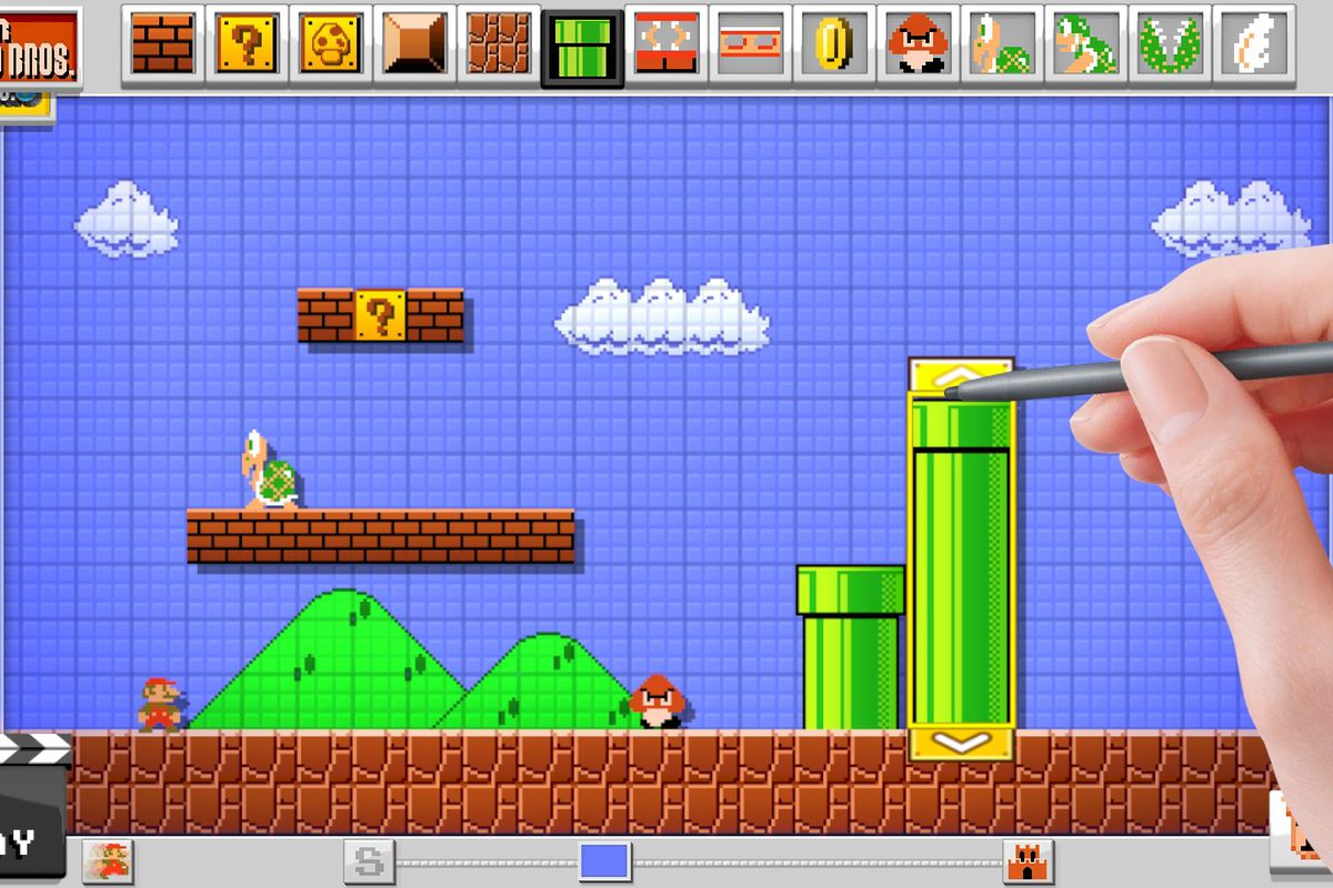 A screenshot of Super Mario Maker on Wii U with a hand holding a stylus