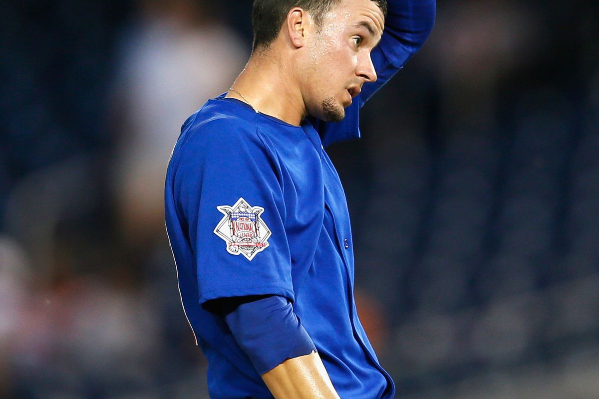 Starting pitcher Chris Rusin of the Chicago Cubs reacts after giving up a run against the Washington Nationals at Nationals Park in Washington, DC.  (Photo by Rob Carr/Getty Images)