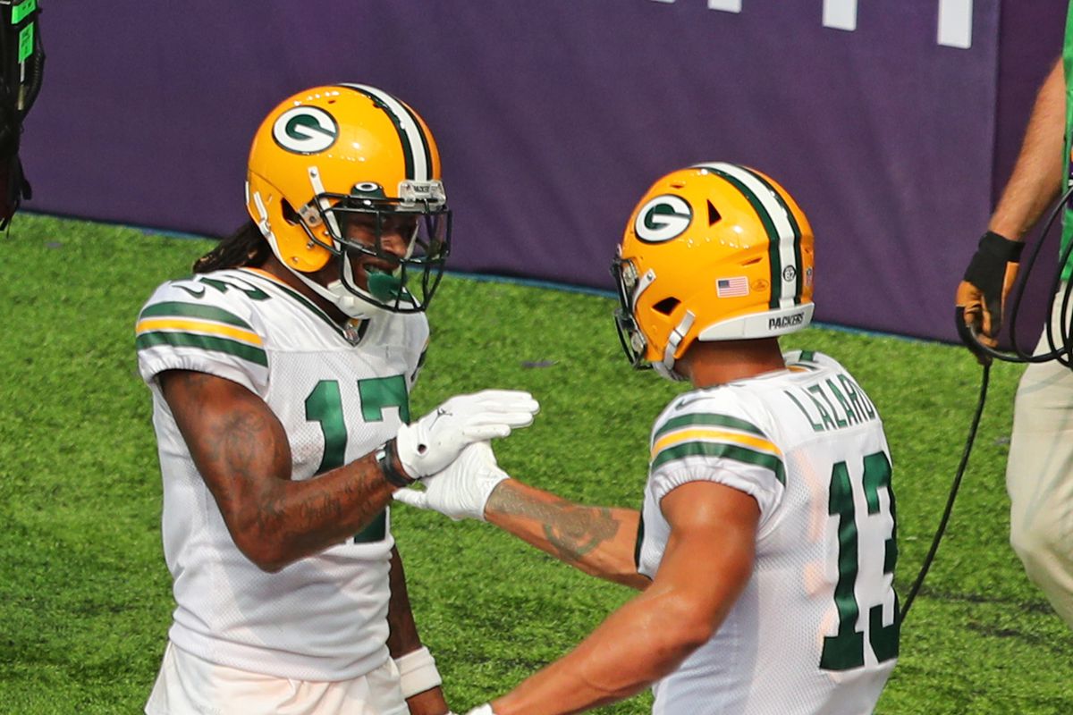 Green Bay Packers wide receivers Davante Adams and Allen Lazard celebrate a touchdown versus the Vikings.