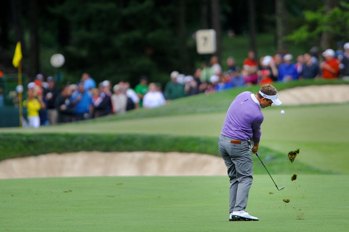 June 1, 2012; Dublin, OH, USA: Luke Donald hits his approach shot on the seventeenth hole during the second round of the Memorial Tournament at Muirfield Village Golf Club.  Mandatory Credit: Eric P. Mull-USPRESSWIRE
