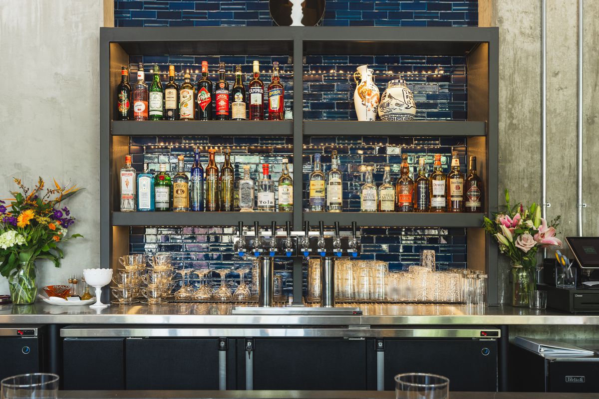 A bar with exposed blue tile. 