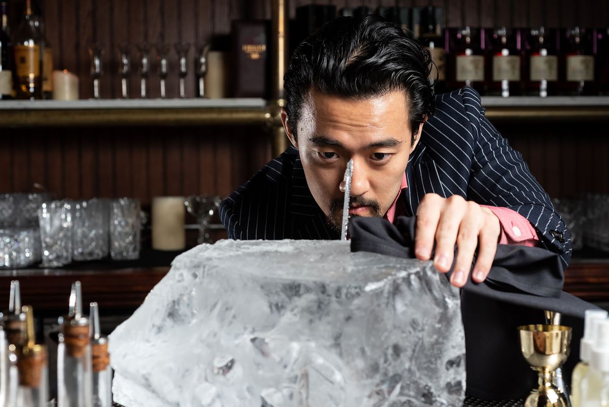 Bar director Kevin Lee cutting ice at The Wolves