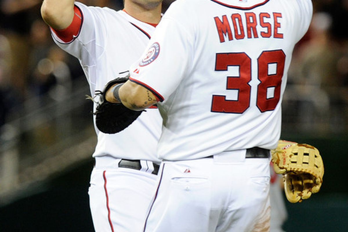 WASHINGTON, DC - JUNE 14:  Ryan Zimmerman #11 and Michael Morse #38 of the Washington Nationals celebrate after an 8-6 victory against the St. Louis Cardinals at Nationals Park on June 14, 2011 in Washington, DC.  (Photo by Greg Fiume/Getty Images)
