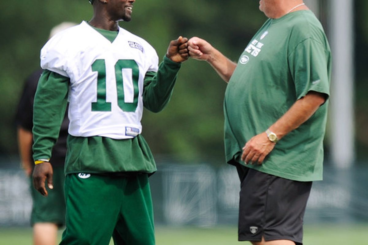 FLORHAM PARK, NJ - AUGUST 07:  Santonio Holmes #10 of the New York Jets speaks with head coach Rex Ryan at NY Jets Practice Facility on August 7, 2011 in Florham Park, New Jersey.  (Photo by Patrick McDermott/Getty Images)