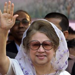 In this Jan. 20, 2014 file photo, Bangladesh's former Prime Minister and opposition Bangladesh Nationalist Party (BNP) leader Khaleda Zia, waves as she arrives for a public meeting in Dhaka, Bangladesh. A Bangladesh court issued an arrest warrant Wednesday for the ex-Prime Minister in two graft cases after she failed to appear in court for the fourth time.