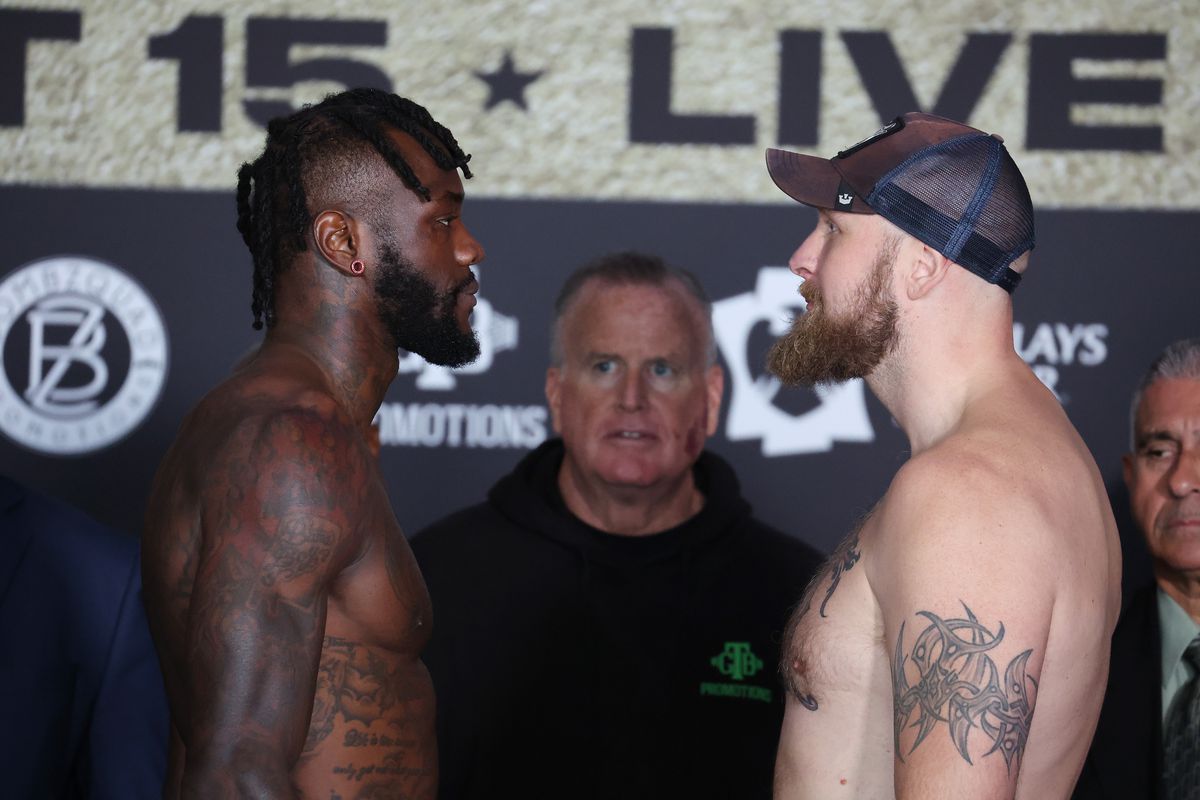 Deontay Wilder and Robert Helenius face off during their weigh in at Barclays Center on October 14, 2022 in Brooklyn, New York.