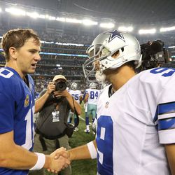 Manning and Tony Romo after the Week 1 loss to the Cowboys