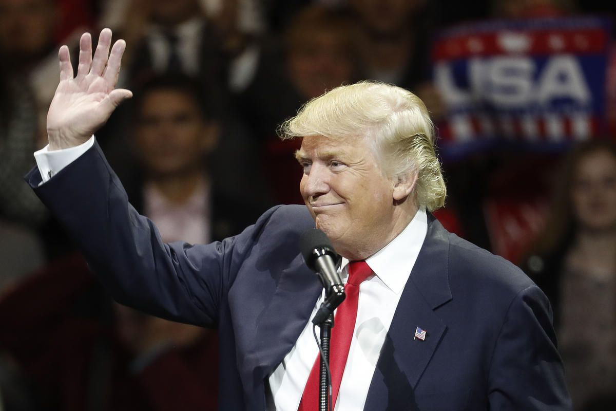 President-elect Donald Trump waves and smiles as he speaks during the first stop of his post-election tour, Thursday, Dec. 1, 2016, in Cincinnati.