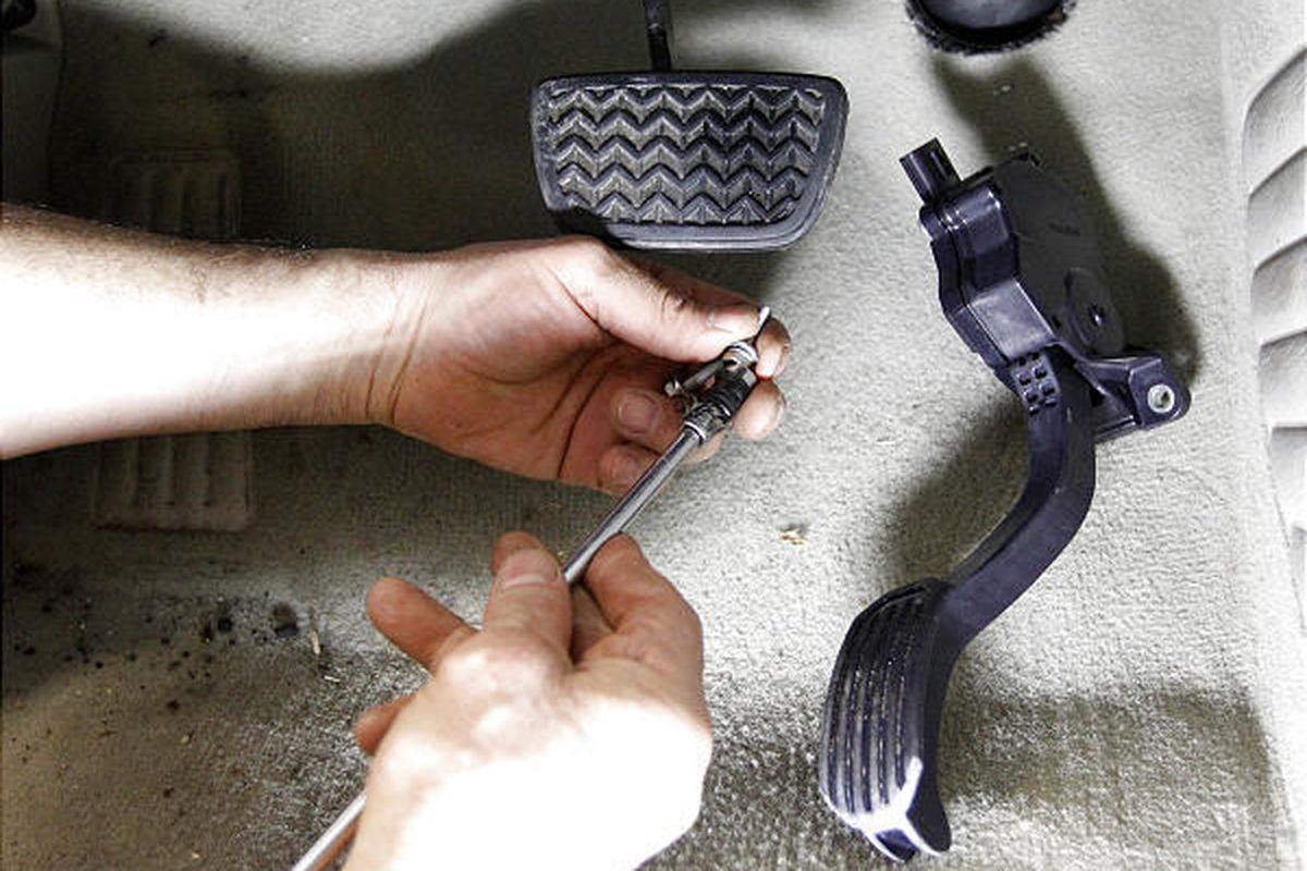 A modified accelerator pedal from a Toyota 2007 Hybrid Camry is replaced in Alexandria, Va., on Feb. 8.