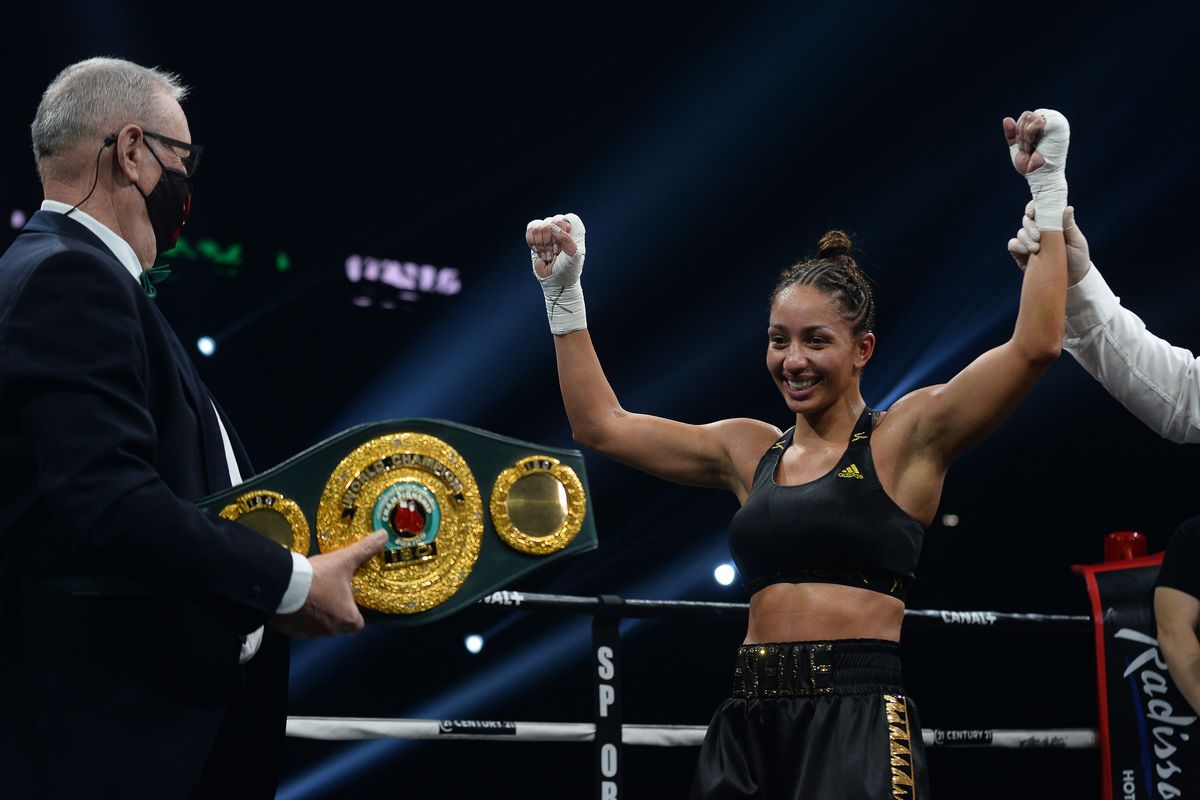 France’s Estelle Mossely-Yoka (R) celebrates retaining her belt after winning against Germany’s Verena Kaiser in their IBO lightweight title boxing match at the H Arena in Nantes, western France, on March 5, 2021.