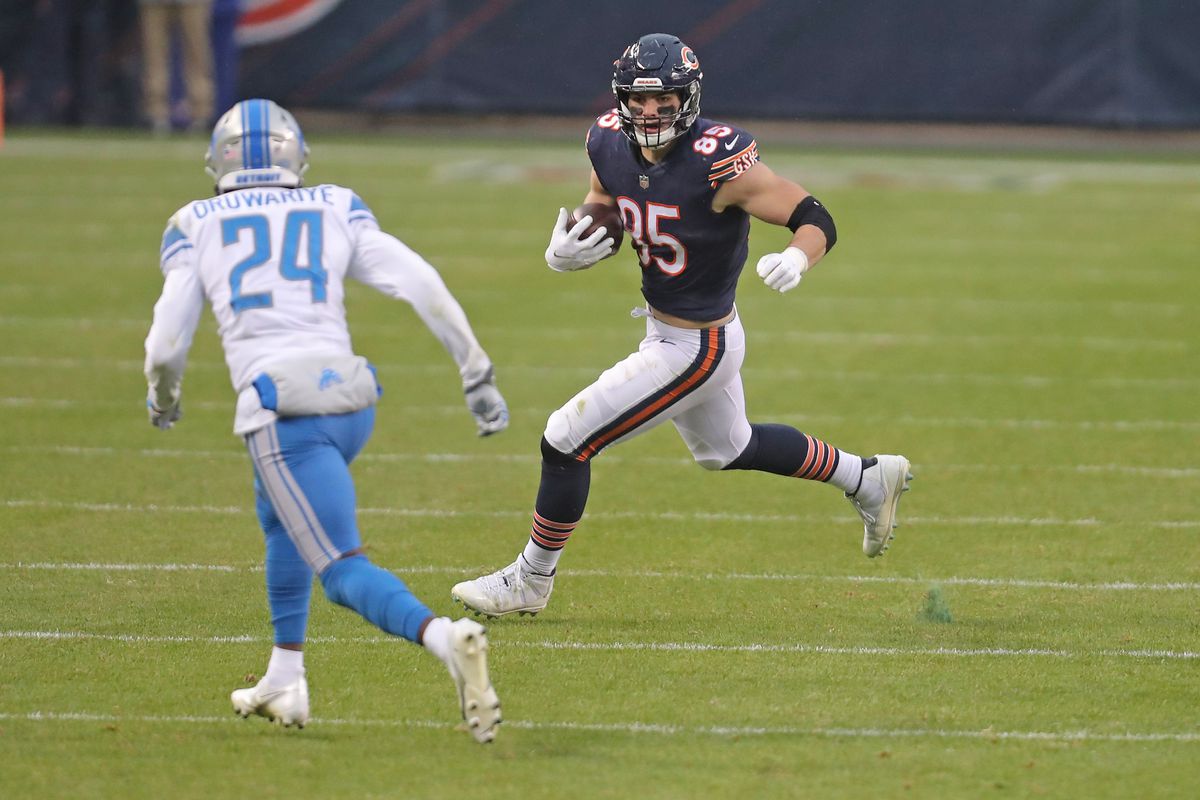 Chicago Bears tight end Cole Kmet (85) runs against Detroit Lions cornerback Amani Oruwariye (24) during the second half at Soldier Field.