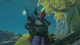 Link står på en Sky Island iført Phantom Armor om natten, med månen lige ved siden af ​​ham i Zelda: Tears of the Kingdom