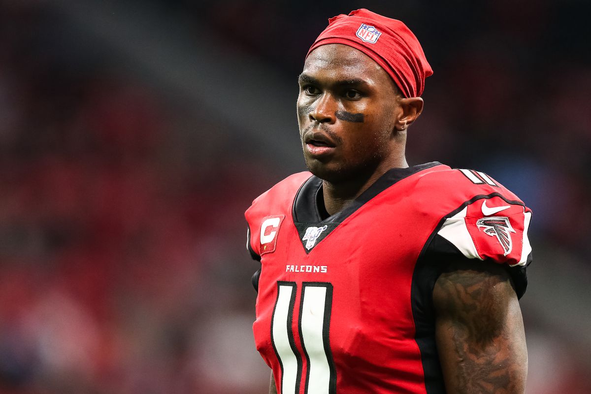 Julio Jones #11 of the Atlanta Falcons looks on during the first half of a game against the Jacksonville Jaguars at Mercedes-Benz Stadium on December 22, 2019 in Atlanta, Georgia.