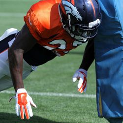 Broncos RB Ronnie Hillman throws his shoulder into the sled during drills