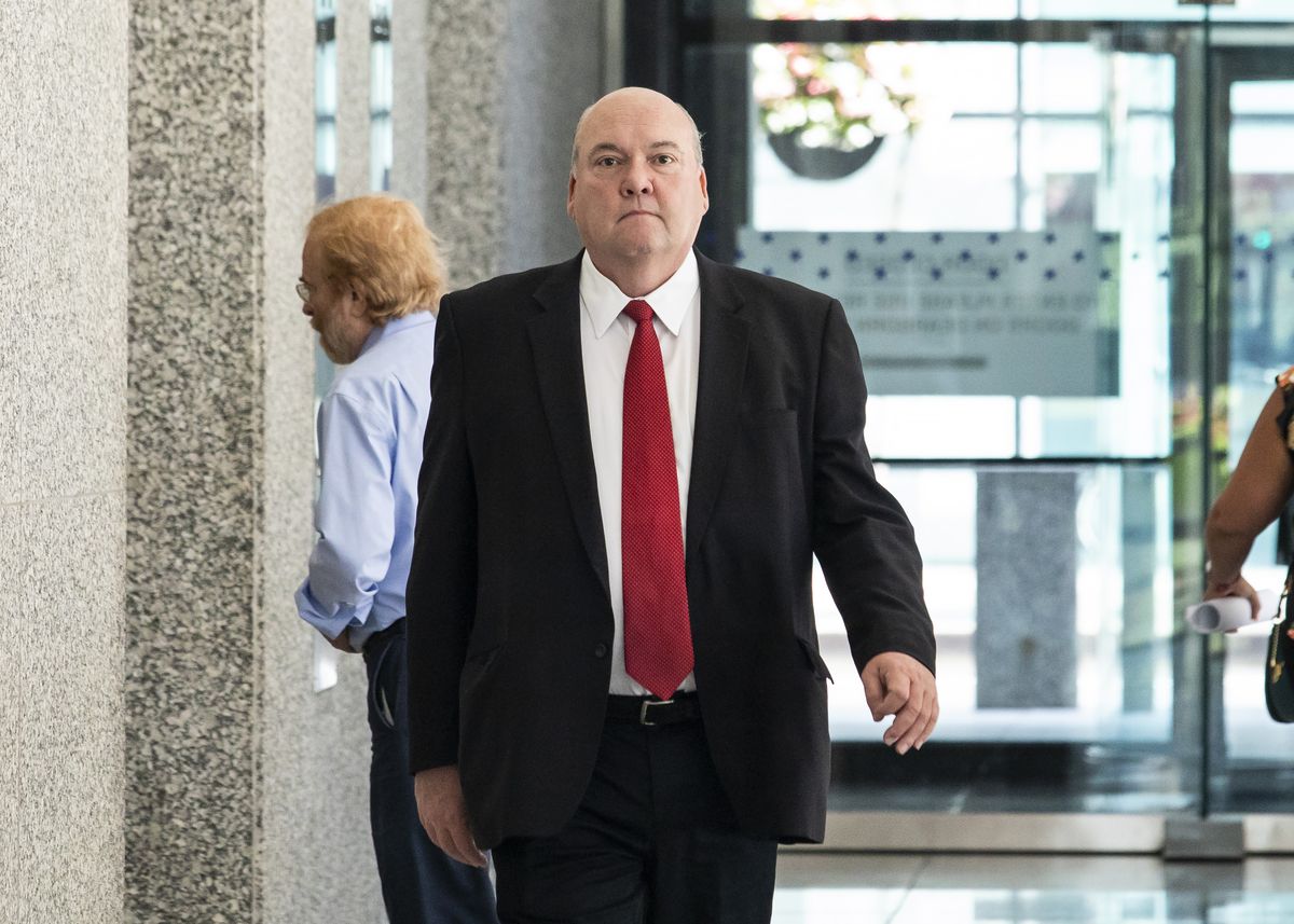 Former longtime Chicago Teamsters boss John T. Coli leaves the Dirksen Federal Courthouse Tuesday after pleading guilty to receiving a prohibited payment and filing a false income tax return. 