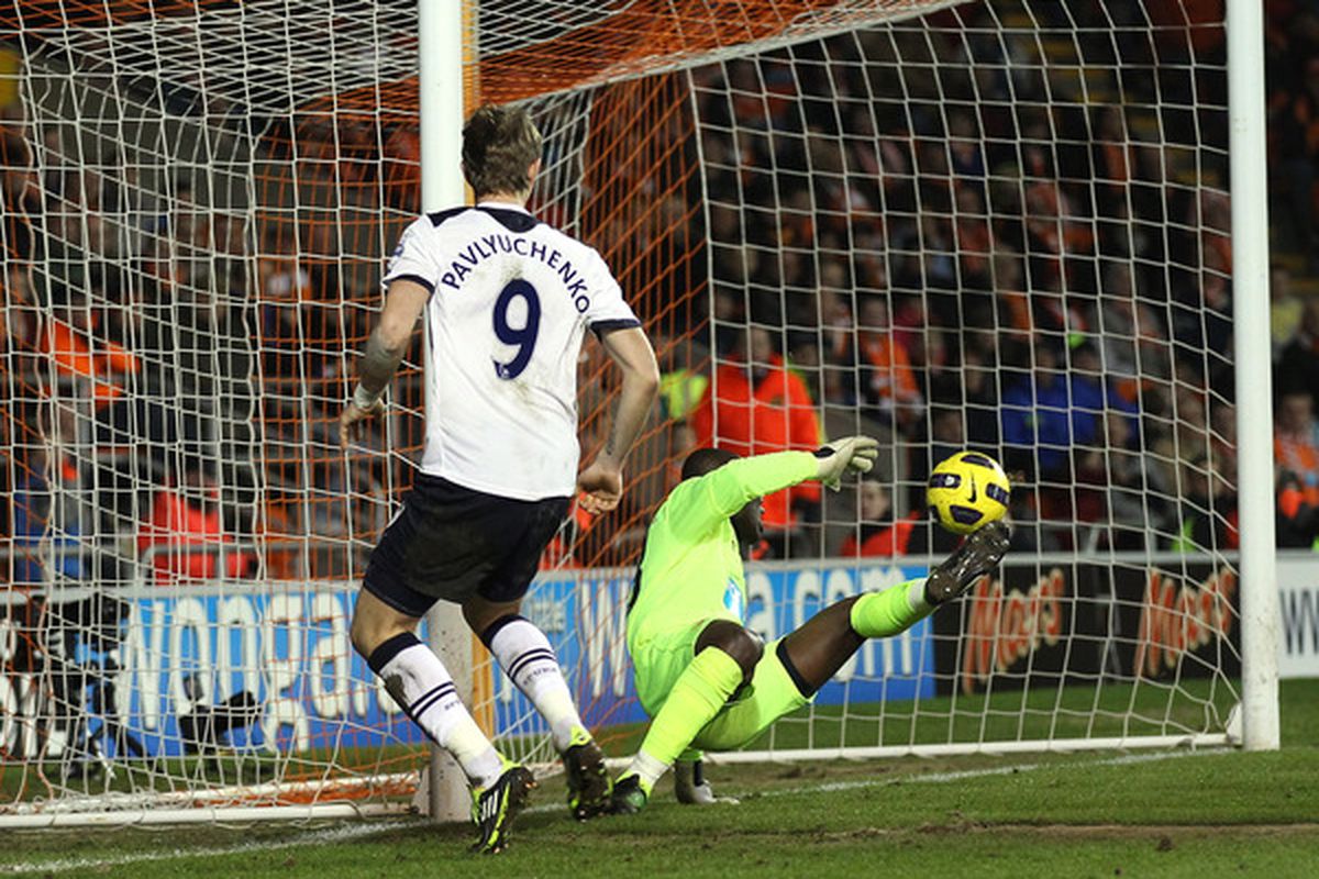Richard Kingson of Blackpool makes a save from Roman Pavlyuchenko of Tottenham Hotspur