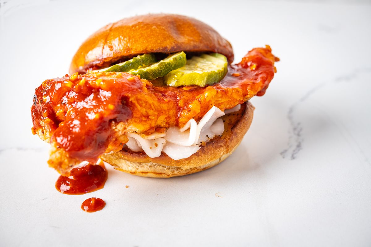 A Korean fried chicken sandwich with pickles and radish from the Queen Mother’s inside Ghostline
