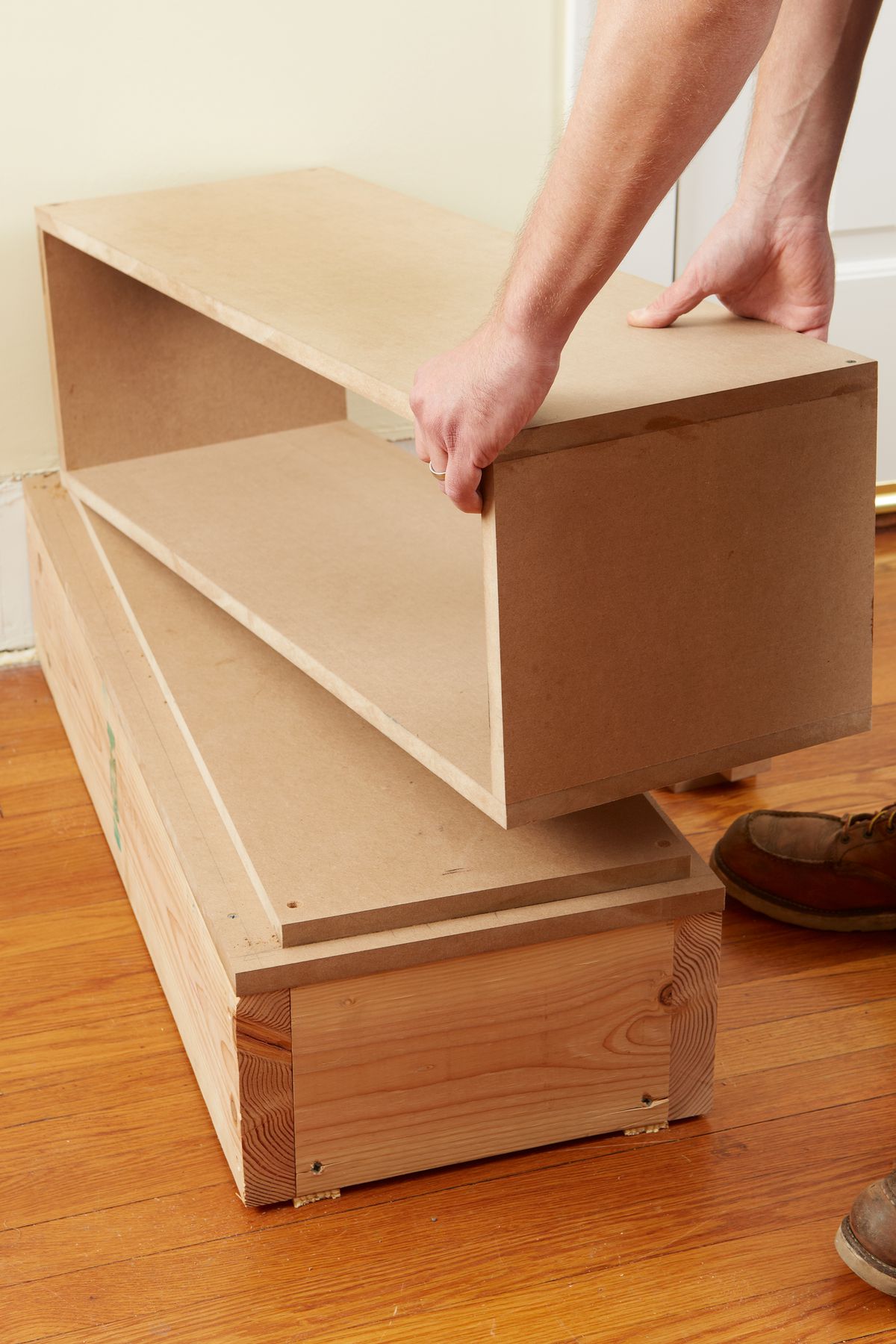 Man Stacks Boxes To Make Room Divider