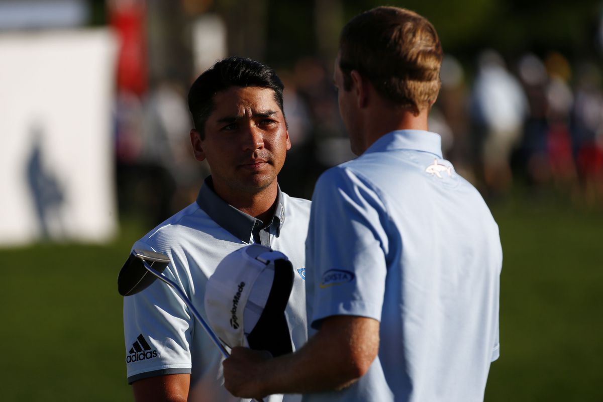 Jason Day of Australia shakes hands with Brendon Todd after finishing on the 18th green during the Third Round of the BMW Championship at Conway Farms Golf Club on September 19, 2015 in Lake Forest, Illinois.