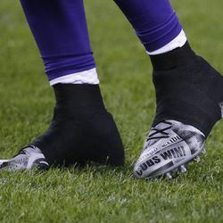 Minnesota Vikings wide receiver Laquon Treadwell's cleats are shown with Cubs Win! on them during warmups before an NFL football game against the Chicago Bears in Chicago, Monday, Oct. 31, 2016. The Cubs are playing the Cleveland Indians in the World Series. 