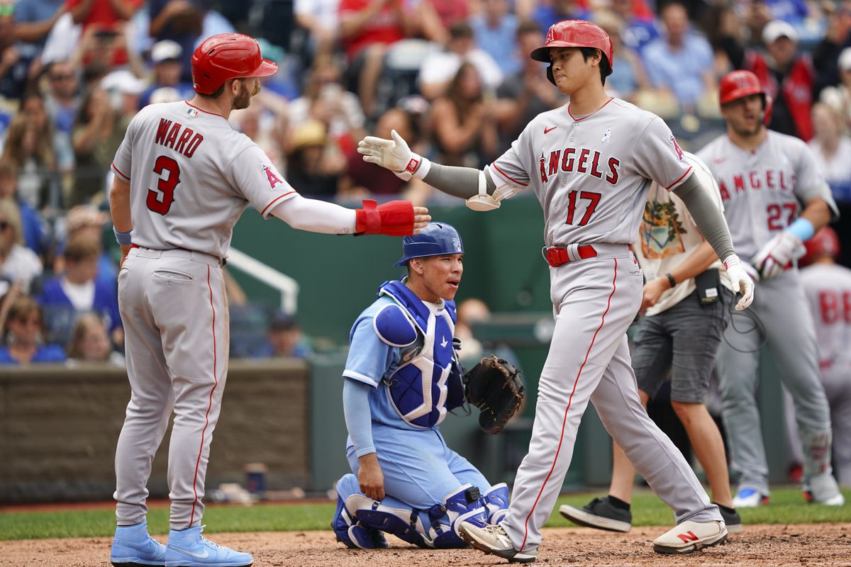 Shohei Ohtani #17 of the Los Angeles Angels celebrates with Taylor Ward #3 after hitting a home run against the Kansas City Royals during the fifth inning at Kauffman Stadium on June 18, 2023 in Kansas City, Missouri.