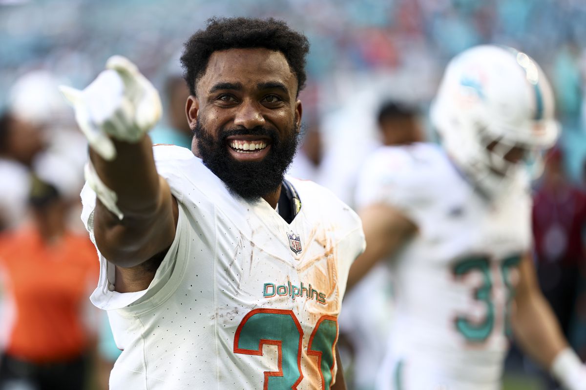 Raheem Mostert of the Miami Dolphins smiles during halftime of an NFL football game against the New York Jets at Hard Rock Stadium on December 17, 2023 in Miami Gardens, Florida.