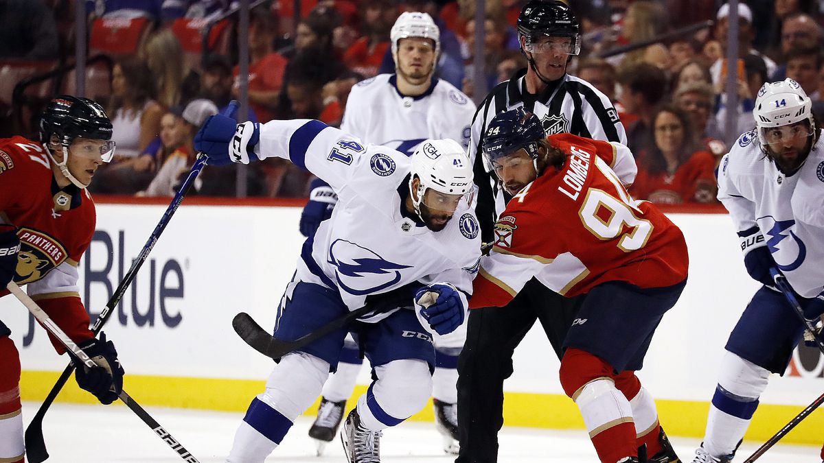 Pierre-Edouard Bellemare #41 of the Tampa Bay Lightning tangles with Ryan Lomberg #94 of the Florida Panthers during a face off in Game One of the Second Round of the 2022 Stanley Cup Playoffs at the FLA Live Arena on May 17, 2022 in Sunrise, Florida.