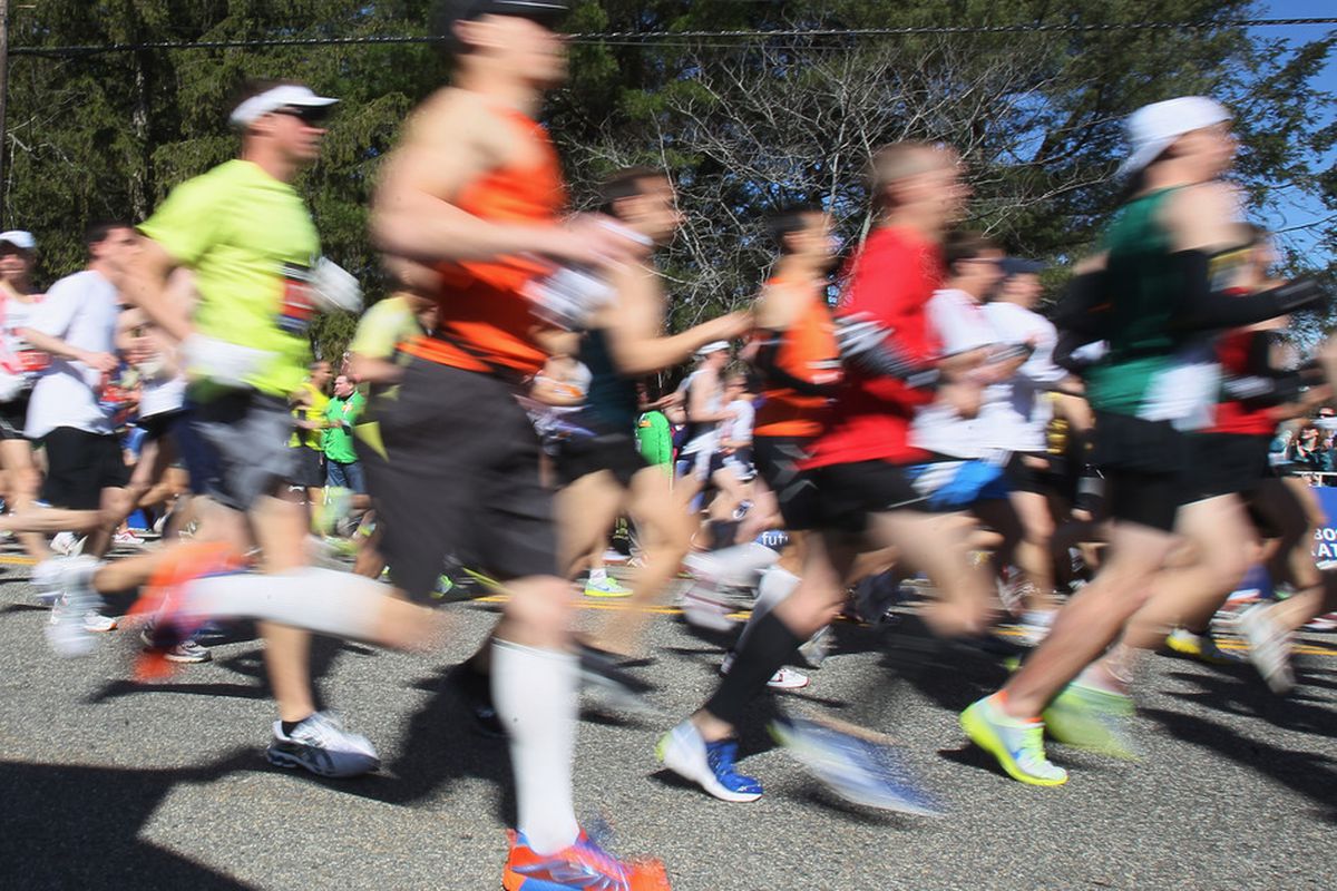 HOPKINTON, MA - APRIL 18:  Runners head out during the start of the 115th Boston Marathon on April 18, 2011 in Hopkinton, Massachusetts.  (Photo by Elsa/Getty Images)