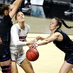 BYU Cougars guards Shaylee Gonzales (2) and Maria Albiero (5) defend Gonzaga Bulldogs forward Eliza Hollingsworth (12) during the WCC women’s basketball tournament finals at the Orleans Arena in Las Vegas on Tuesday, March 9, 2021. Gonzaga won 43-42.