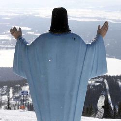 In this Feb. 20, 2011, file photo, the statue of Jesus Christ at Whitefish Mountain Resort overlooks Whitefish Lake and the Flathead Valley in Whitefish, Mont. A Montana judge says the statue that was placed on federal land on Big Mountain near Whitefish nearly 60 years ago can remain.