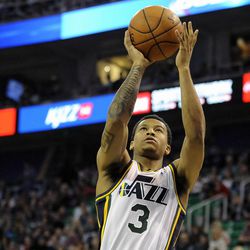 Utah Jazz point guard Trey Burke (3) goes in for an easy layup during a game at EnergySolutions Arena on Monday, Nov. 25, 2013.