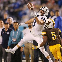 Brigham Young Cougars wide receiver Colby Pearson (3) can't come up with the ball as Wyoming Cowboys cornerback Rico Gafford (5) defends during the Poinsettia Bowl in San Diego on Wednesday, Dec. 21, 2016.