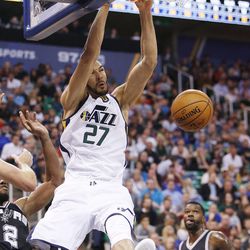 Utah Jazz center Rudy Gobert (27) slams over the San Antonio Spurs during NBA action in Salt Lake City on Friday, Nov. 4, 2016. The Spurs won 100-86.