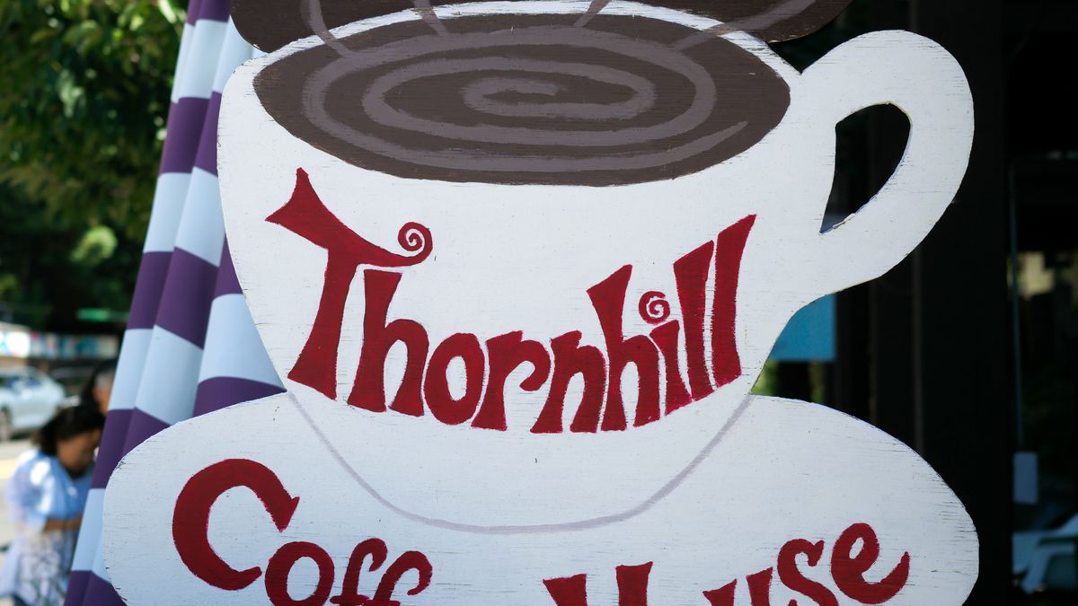 A hand-painted sign for Thornhill Coffee House.