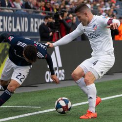 FOXBOROUGH, MA - MARCH 24: FC Cincinnati defender Greg Garza #4 takes the ball away from New England Revolution midfielder Carles Gil #22 at Gillette Stadium on March 24, 2019 in Foxborough, Massachusetts. (Photo by J. Alexander Dolan - The Bent Musket)