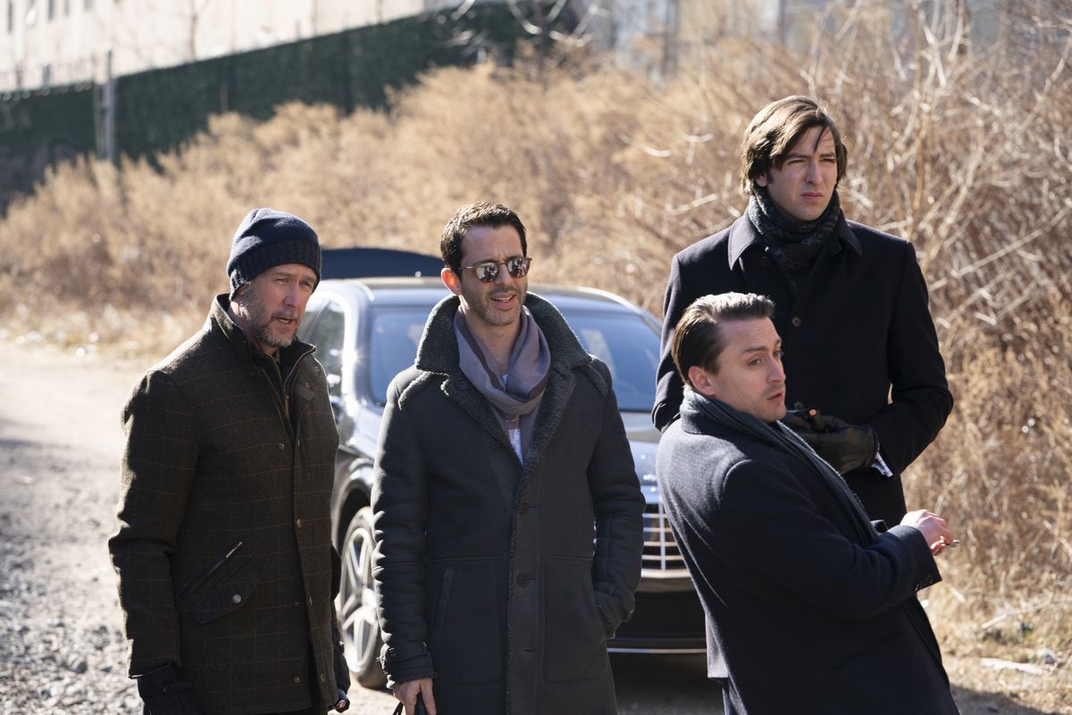 Succession - Connor, Kendall, Roman and Greg standing in front of a car
