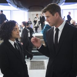 Agent M (Tessa Thompson) and Agent H (Chris Hemsworth) in the lobby of MIB London in "Men in Black: International."