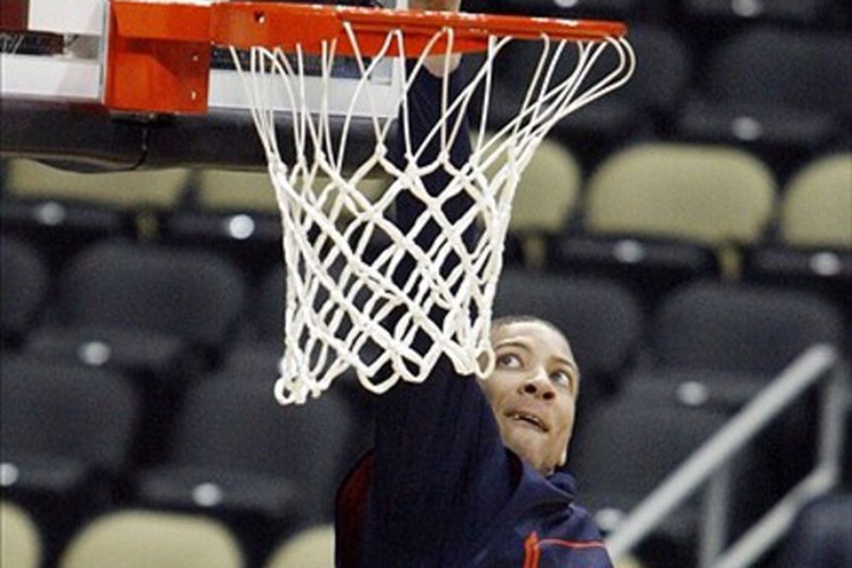 Mar 14, 2012; Pittsburgh, PA, USA: Syracuse Orange forward Brandon Triche (20) dunks during practice for the second round of the 2012 NCAA men's basketball tournament at the CONSOL Energy Center.  Mandatory Credit: Charles LeClaire-US PRESSWIRE