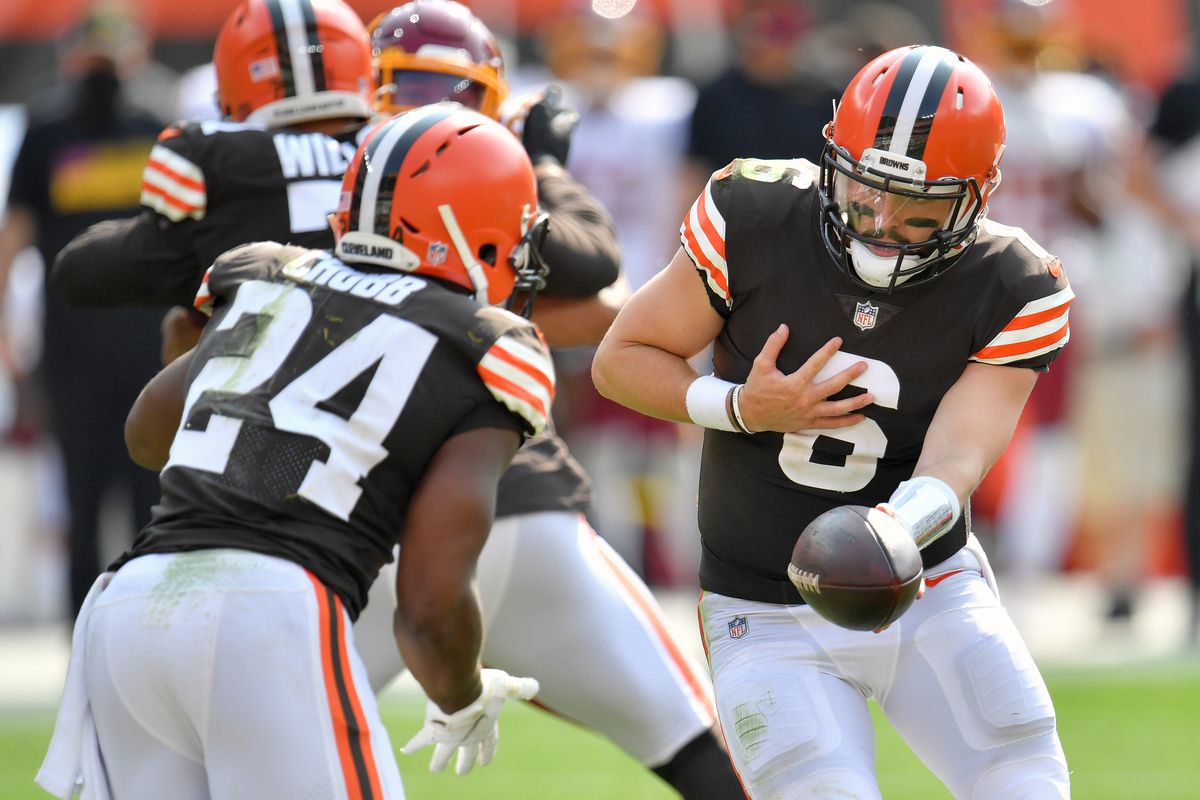 Quarterback Baker Mayfield hands off to running back Nick Chubb of the Cleveland Browns during the second half against the Washington Football Team at FirstEnergy Stadium on September 27, 2020 in Cleveland, Ohio. The Browns defeated the Washington Football Team 34-20.