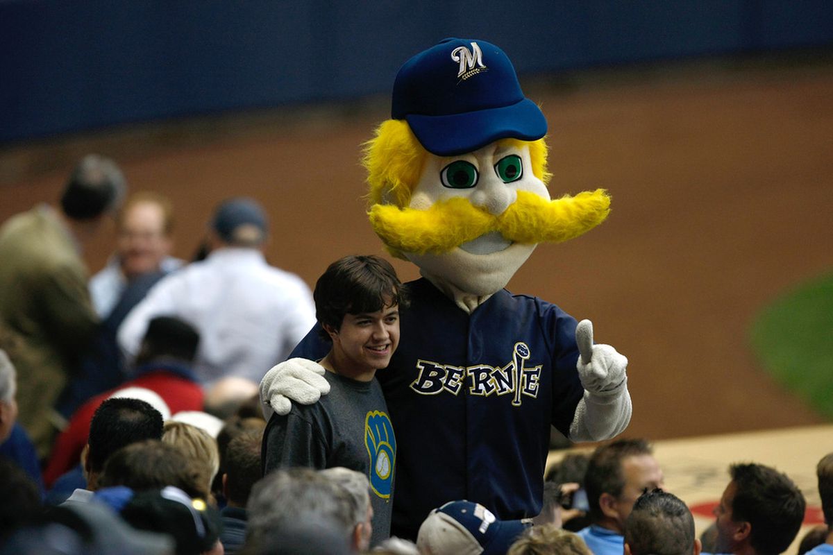 MILWAUKEE, WI - JUNE 24: Bernie Brewer poses with a fan during the game between the Minnesota Twins against the Milwaukee Brewers at Miller Park on June 24, 2011 in Milwaukee, Wisconsin. (Photo by Scott Boehm/Getty Images)
