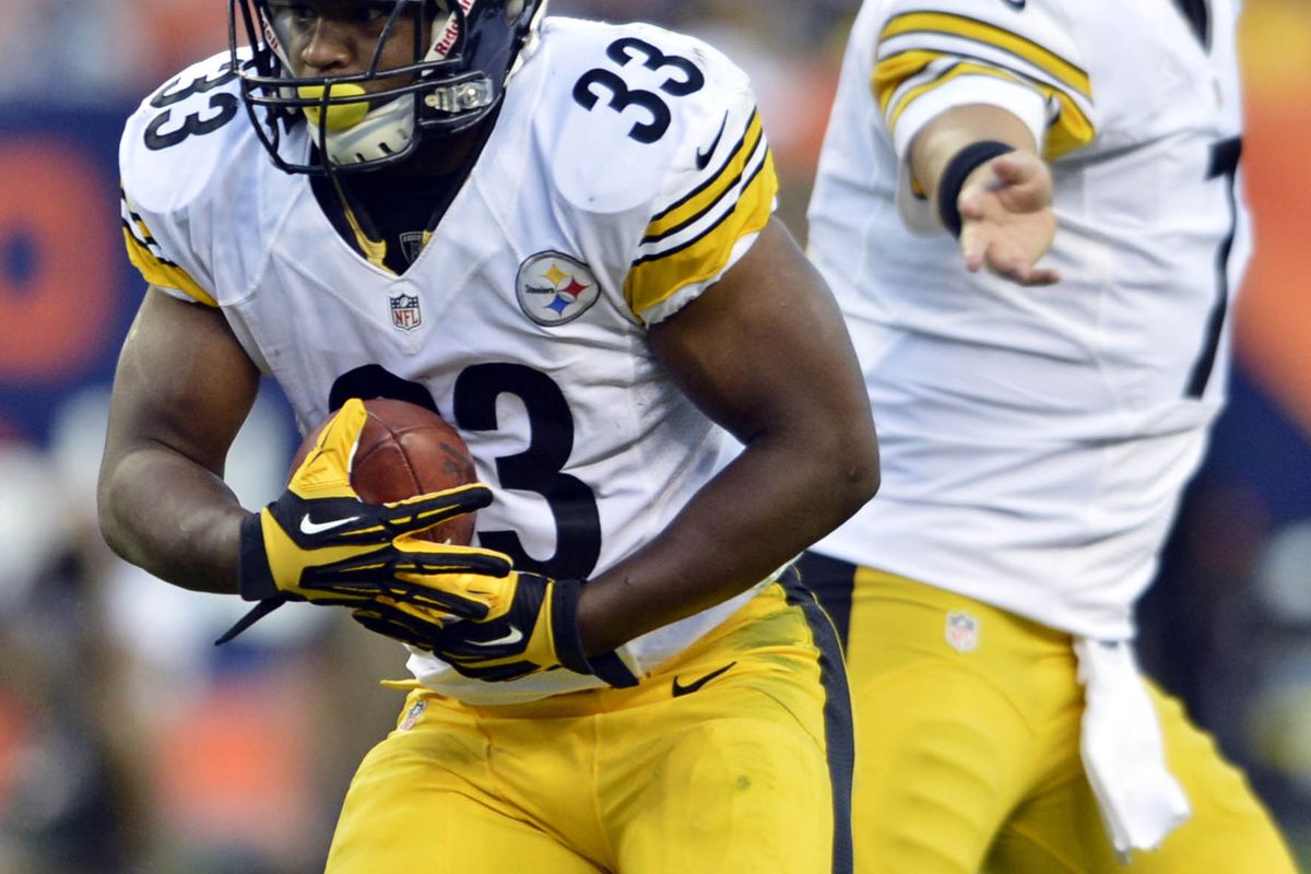 September 9 2012; Denver, CO, USA;Pittsburgh Steelers running back Isaac Redman (33) carries the football during the first quarter against the Denver Broncos at Sports Authority Field. Mandatory Credit: Ron Chenoy-US PRESSWIRE