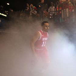 Utah Utes guard Brandon Taylor (11) emerges from the tunnel during player introductions before the Pac-12 conference tournament championship game against the Oregon Ducks at the MGM Grand Garden Arena in Las Vegas, Saturday, March 12, 2016.