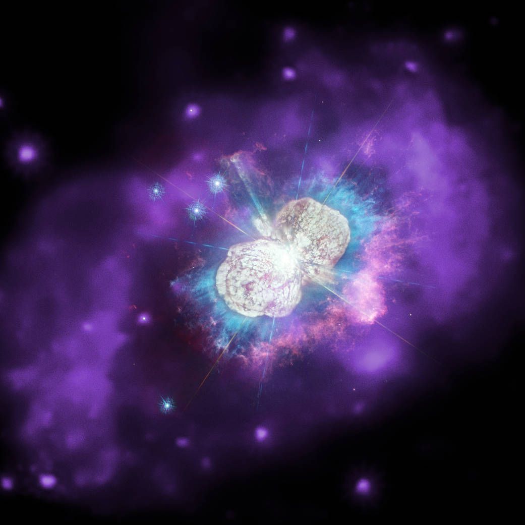 What will be the next star in our Milky Way galaxy to explode as a supernova? Astronomers aren’t certain, but one candidate is in Eta Carinae, a volatile system containing two massive stars that closely orbit each other. This image has three types of light: optical data from Hubble (appearing as white), ultraviolet (cyan) from Hubble, and X-rays from Chandra (appearing as purple emission).