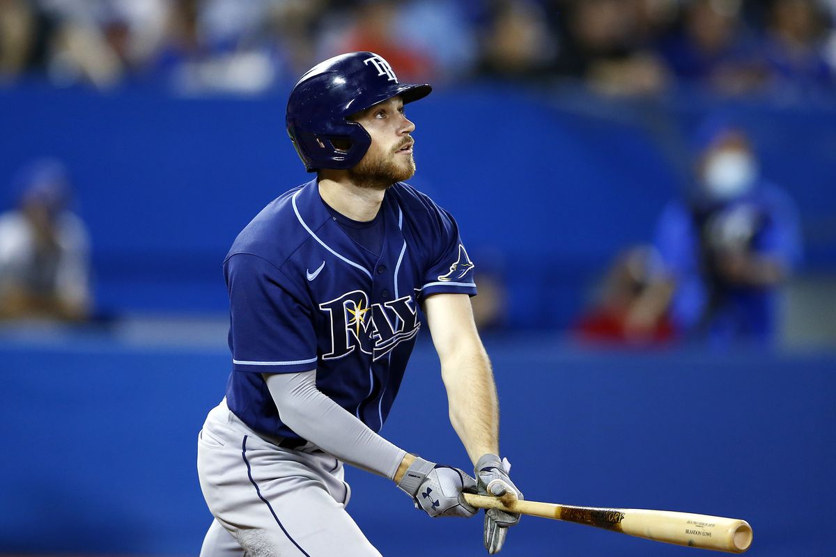 Brandon Lowe #8 of the Tampa Bay Rays hits a solo home run in the eighth inning during a MLB game against the Toronto Blue Jays at Rogers Centre on September 14, 2021 in Toronto, Ontario, Canada.