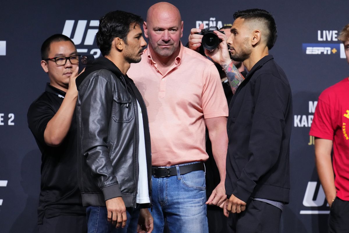 Alexandre Pantoja of Brazil and Alex Perez face off during the UFC 277 press conference at American Airlines Center
