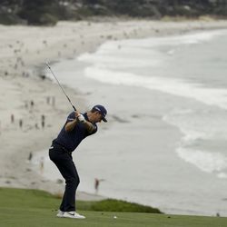 Justin Rose, of England, hits from the fairway on the ninth hole during the second round of the U.S. Open golf tournament Friday, June 14, 2019, in Pebble Beach, Calif. (AP Photo/Marcio Jose Sanchez)