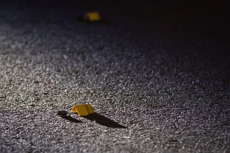 Multiple shell casings could be seen in the street as Chicago police investigate in the 3700 block of West McLean Avenue in Logan Square, where authorities said a 29-year-old man was shot multiple times Saturday night.