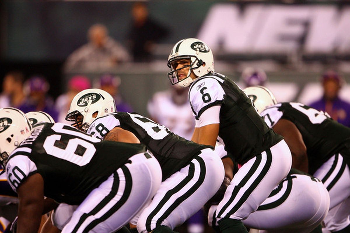 Quarterback Mark Sanchez (6) of the New York Jets stands behind the line of scrimmage against the Minnesota Vikings at New Meadowlands Stadium on October 11 2010 in East Rutherford New Jersey.  (Photo by Andrew Burton/Getty Images)